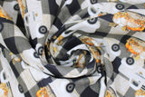 Swirled swatch Truck fabric (white and black buffalo check fabric with small white trucks with pumpkins in the bed and "Harvest" text on truck side)