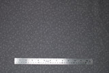 Flat swatch bubbles fabric (dark grey fabric with light grey circular bubble style dots allover in small and medium)