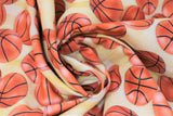 Swirled swatch sports life fabric (white/yellow blended colour look fabric with tossed realistic look orange basketballs allover)