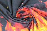Swirled swatch flames fabric (black fabric with large orange and yellow realistic look flames along bottom)