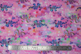 Flat swatch bright floral print in peony (light pink and pastel colours marbled fabric with tossed floral designs with stems in bright blues/purples/pinks/white print allover)