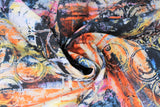Swirled swatch orange multi fabric (abstract paint look fabric on white in black, yellow, orange, pink with various textures, shapes and circles)