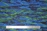 Flat swatch blue and green fabric (abstract paint look fabric on medium blue with dark blue and light green stripe like abstract shapes)