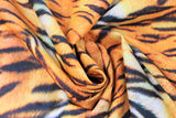 Swirled swatch tiger print fabric (white/orange fabric with black tiger stripes and fur look texture)
