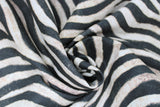 Swirled swatch zebra print fabric (white fabric with black zebra stripes and fur texture look)