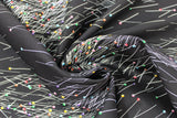 Swirled swatch Sewing Box fabric (black fabric with realistic look tossed sewing pins with coloured circular heads allover)