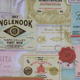 Square swatch Paris themed upholstery fabric (collage of French labels/stamps/seals in various shapes and colours)
