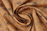 Swirled swatch halloween printed fabric in Spider Webs on Orange (black webs on burnt orange)
