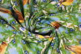 Swirled swatch cedarwax fabric (light blue fabric with tossed branches with greenery allover some snow covered with blue berries allover and tossed yellow, brown, grey colourway birds)