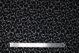 Flat swatch Silver Whisps fabric (black fabric with tossed silver leafy look wisps allover)
