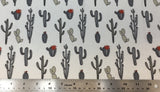 Flat swatch multi cactus style printed fabric in grey (white fabric with assorted size/shape cartoon cacti in grey shades)
