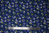 Flat swatch navy toss fabric (navy fabric with small tossed wildflower floral in white, purple, yellow floral heads with green stems/leaves)