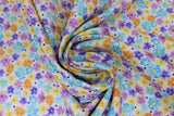 Swirled swatch natural dots fabric (off white fabric with tiny tossed floral heads allover in purple, blue, orange, yellow and tossed navy tiny dots)