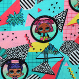 Square swatch LOL Surprise Totally Awesome fabric (pink, teal, yellow fabric with geometric and random designs allover with black circular badges with full colour LOL characters within)