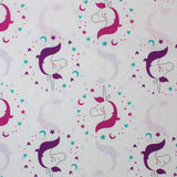 Square swatch Beautiful Unicorn fabric (white fabric with small closed-eyed drawn style unicorns with pink manes and purple manes outlined in pink, purple, and blue stars and hearts making circle shapes around heads)