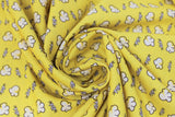 Swirled swatch popcorn themed fabric in Time to Pop (popcorn pieces and "POP" text on yellow)