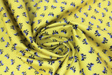 Swirled swatch Bows fabric (pale mustard fabric with tossed black bows with white accents)