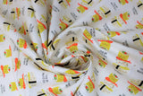 Swirled swatch You Had Me At Sushi fabric (white fabric with illustrative stacked sushi rolls/pieces with "You had me at sushi" etc text)