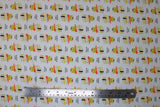 Flat swatch You Had Me At Sushi fabric (white fabric with illustrative stacked sushi rolls/pieces with "You had me at sushi" etc text)