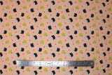 Flat swatch Maki Love fabric (pale pink fabric with tossed black and beige maki sushi rolls with kawaii style faces and tossed hearts)