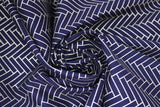 Swirled swatch Gold Lines Black fabric (black fabric with alternating diagonal rectangles in gold with sparkle/metallic effect comprising herringbone/brick like chevron pattern allover)