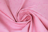 Swirled swatch Scattered Triangles fabric (pink fabric with dark pink hollow triangle outlines scattered allover)