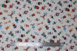 Flat swatch Zootopia Toss fabric (white fabric with small tossed zoo creature graphics in full colour with corresponding animal name, first letter bold and colourful, rest in black)