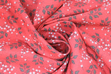 Swirled swatch Sprigs fabric (deep watermelon pink fabric with tossed leafy sprigs in grey and tossed floral sprigs in white with grey stems)