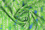 Swirled swatch go fish fabric (medium lime green fabric with white text allover related to summer "beach" "fish" etc. and tossed blue fish silhouettes/outlines and blue stars)