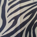 Swatch of tan and black animal-striped print