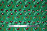 Flat swatch oh fudge fabric (green fabric with small tossed main character movie head and "ohhhhh fudddggge!" "only don't say fudge" text in yellow and white, tossed snowflakes)