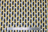 Flat swatch licensed DC Comics printed fabric in Batman Retro Camo (tiled bat logo in black/grey/yellow on white)