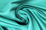 Swirled swatch lapis/turquoise satin fabric