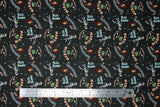 Flat swatch Retro Characters fabric (black fabric with tossed full colour looney tunes characters and names in blue and red with tossed star dots)