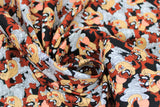 Swirled swatch Taz Expressions fabric (black fabric with busy tossed full colour Tasmanian devil characters allover)