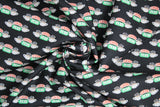 Swirled swatch Central Perk fabric (black fabric with tossed central perk logo and steaming coffee mug on either side repeated)