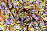 Swirled swatch spell casts fabric (kawaii style cartoon fabric with yellow, orange, grey, purple comic book look rectangle badges with Harry, Hermione and Draco characters with tossed green snakes and spell texts in same colourway "Expelliarmus!" etc.)
