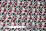 Flat swatch maple leaves fabric (medium grey fabric with tossed hearts and maple leaves in red, white, light and dark grey)