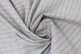 Swirled swatch beige rib knit fabric (pale beige fabric with knit look and subtle grey stripes/accents)