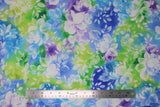 Flat swatch watercolour floral fabric (light blue, blue, purple, light and dark green marbled/watercolour look fabric with large white floral heads and leaves pattern)