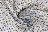 Swirled swatch shark teeth fabric (white fabric with small lines of white, off white, blue and grey shark teeth)