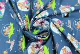 Swirled swatch The Jetsons fabric (dark blue sky fabric with tossed white stars, green space ships with full colour cast inside, circular and oval badges with full colour characters and "The Jetsons" text)