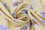 Swirled swatch Tom & Jerry fabric (yellow fabric with tossed cartoon characters with white backgrounds, assorted cat and mouse poses, cheese slices, bats, "Best Foes Forever" text, etc.)