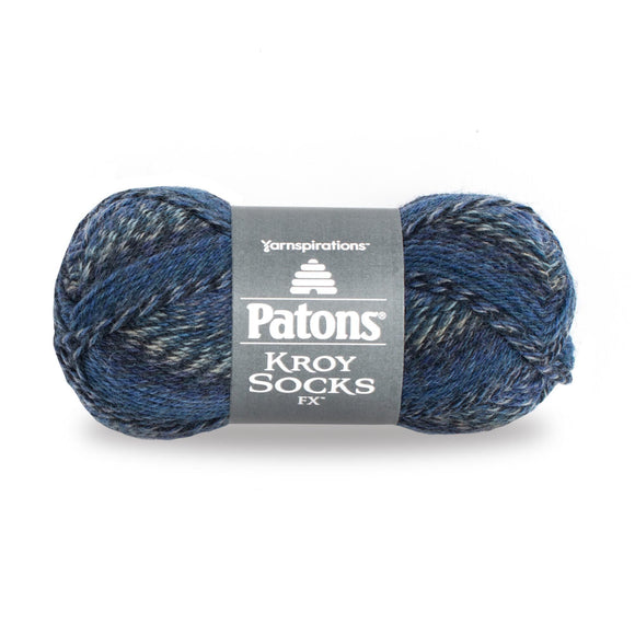 A ball of Patons Kroy Socks FX Yarn in medium to dark blues, white and black colourway