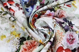 Swirled swatch assorted floral printed fabric in cream (off white fabric with tossed colourfull floral groupings and butterflies in full colour assorted)