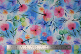 Flat swatch spring fabric (white and blue marbled fabric with tossed pink, purple, blue, orange floral and green/black stems and greenery)