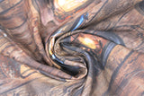 Swirled swatch woody fabric (brown wood grain thick stripes pattern with black/yellow glowing old style lanterns)