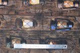 Flat swatch woody fabric (brown wood grain thick stripes pattern with black/yellow glowing old style lanterns)