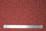 Flat swatch floral fabric (dark red fabric with small tossed greenery and floral allover in green, yellow, pink, and blue)