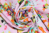 Swirled swatch easter bunny fabric (baby pink fabric with small tossed orange carrots and pink floral heads, tossed easter bunny cartoon graphics and tossed birdhouses)